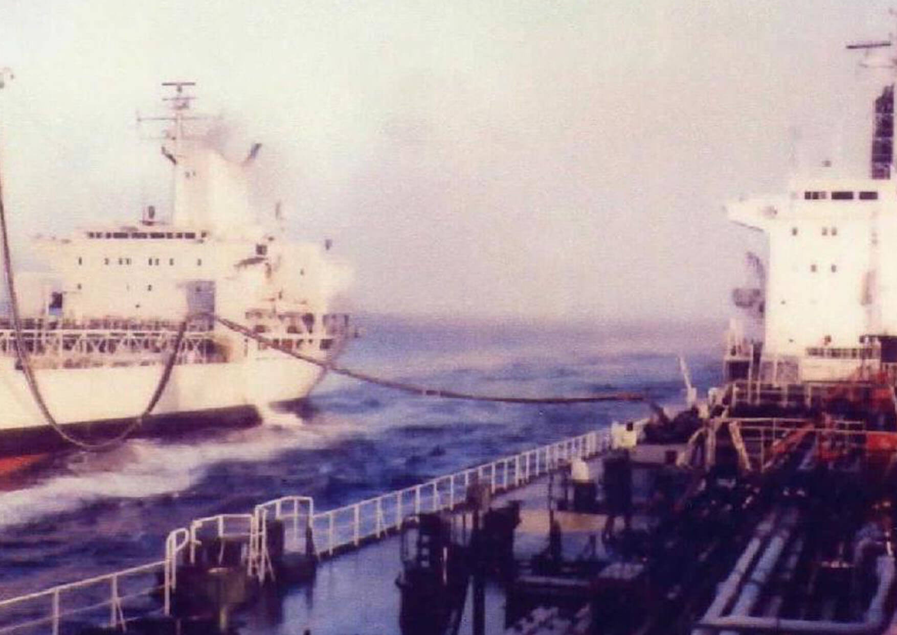Color photograph of underway refuelling taking place